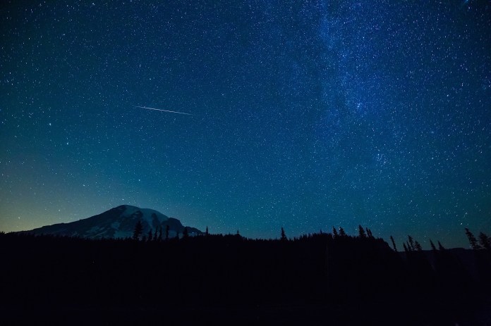 stars and perseids meteor shower over reflection lakes and mount rainier