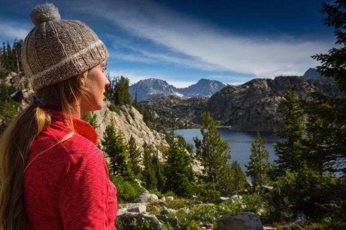 Ellen Slaton hiking to and looking out over Seneca Lake in the Wind River Range