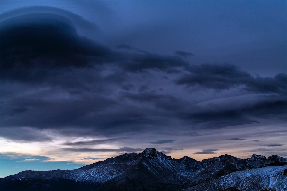 A front rolls in over Long's Peak in spectacular color.