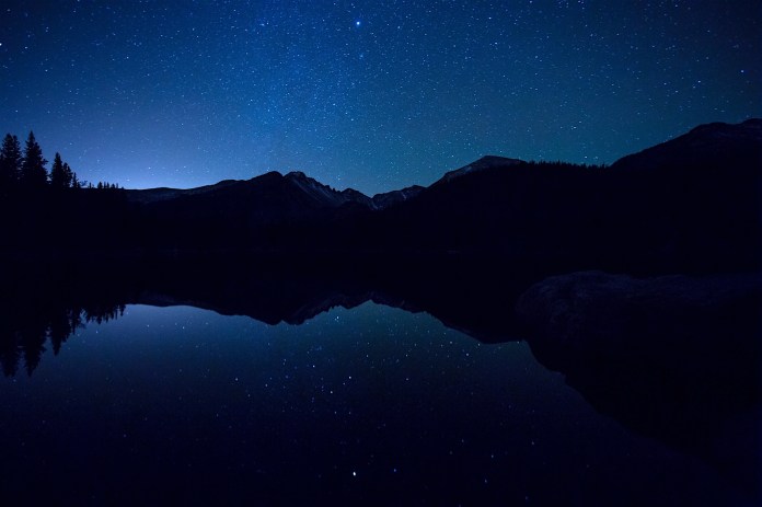 Stars over Long's Peak and Bear lake in Rocky Mountain National Park.