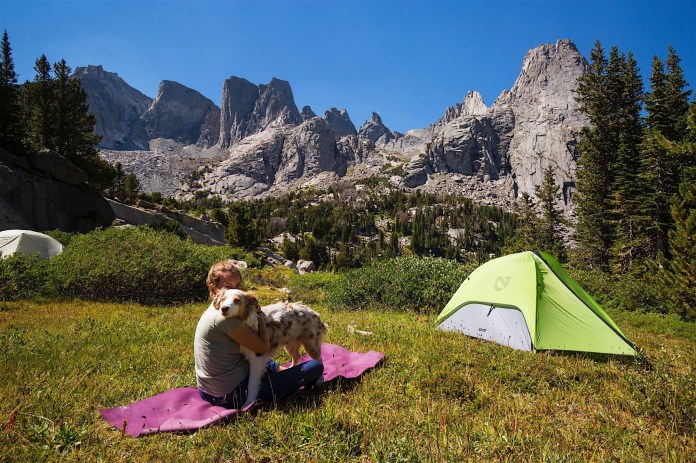 A woman and her dog camped near the Cirque