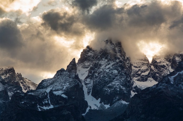 Dramatic clouds loom over Swabachwers Landing in Grand Teton National Park